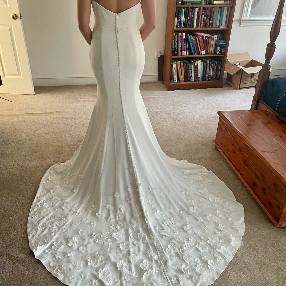 This Kelly Faetanini wedding dress is never worn and unaltered from Jan 2022